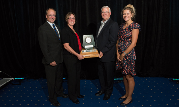Jade Winner: Teck Resources Limited, recipient of the Jake McDonald Annual Reclamation Award. From left to right: Dave Nikolejsin (Deputy Minister of the Ministry of Energy and Mines), Michelle Unger (Senior Environmental Scientist, Teck Resources Limited), Bruce Donald (Manager, Dormant Properties, Teck Resources Limited), Jaimie Dickson (2013 Chair, BC Technical & Research Committee on Reclamation).