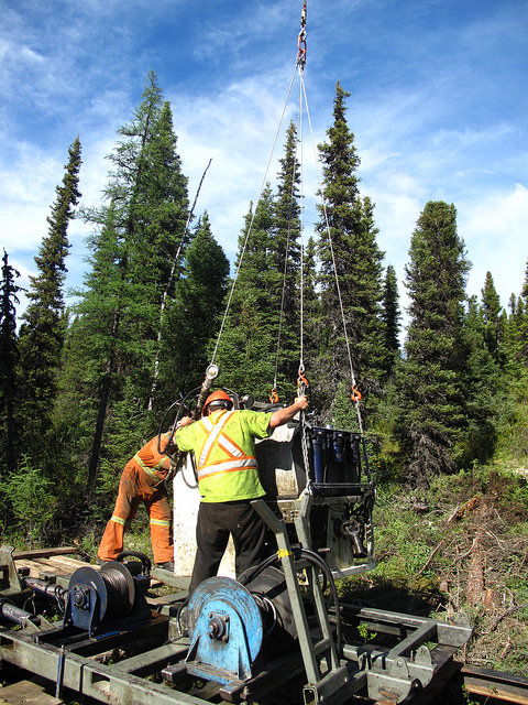 A team is moving the drill components.