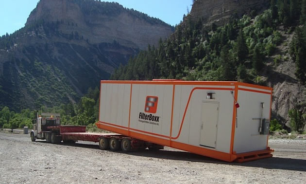 Combo unit offloading Filterboxx Modular Unit at a 303-man camp.